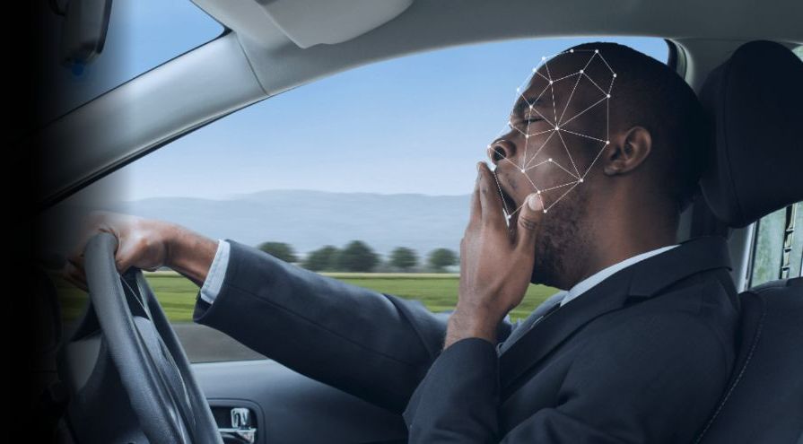 Fatigue monitoring — driver on phone with facial tracking overlay